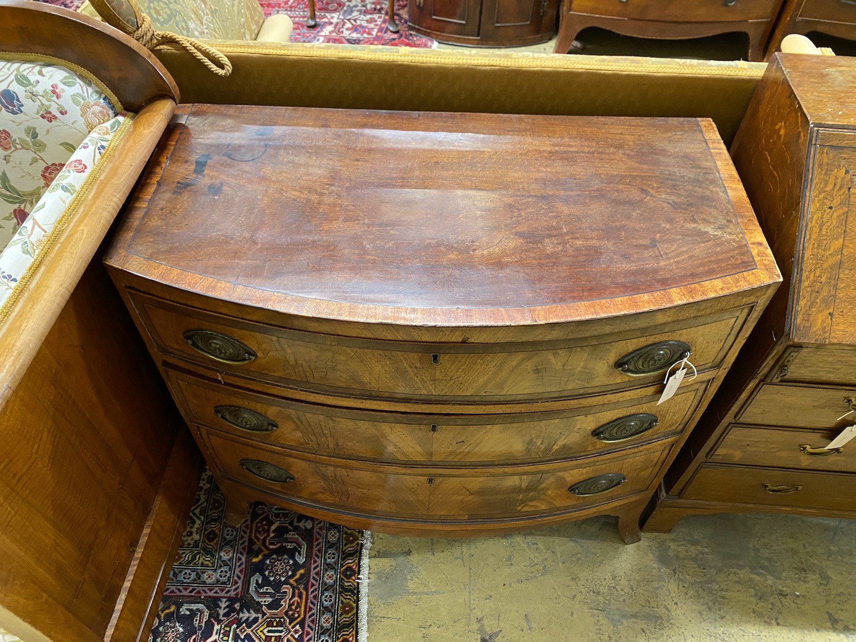 A small Regency banded mahogany three drawer chest, width 90cm, depth 47cm, height 82cm